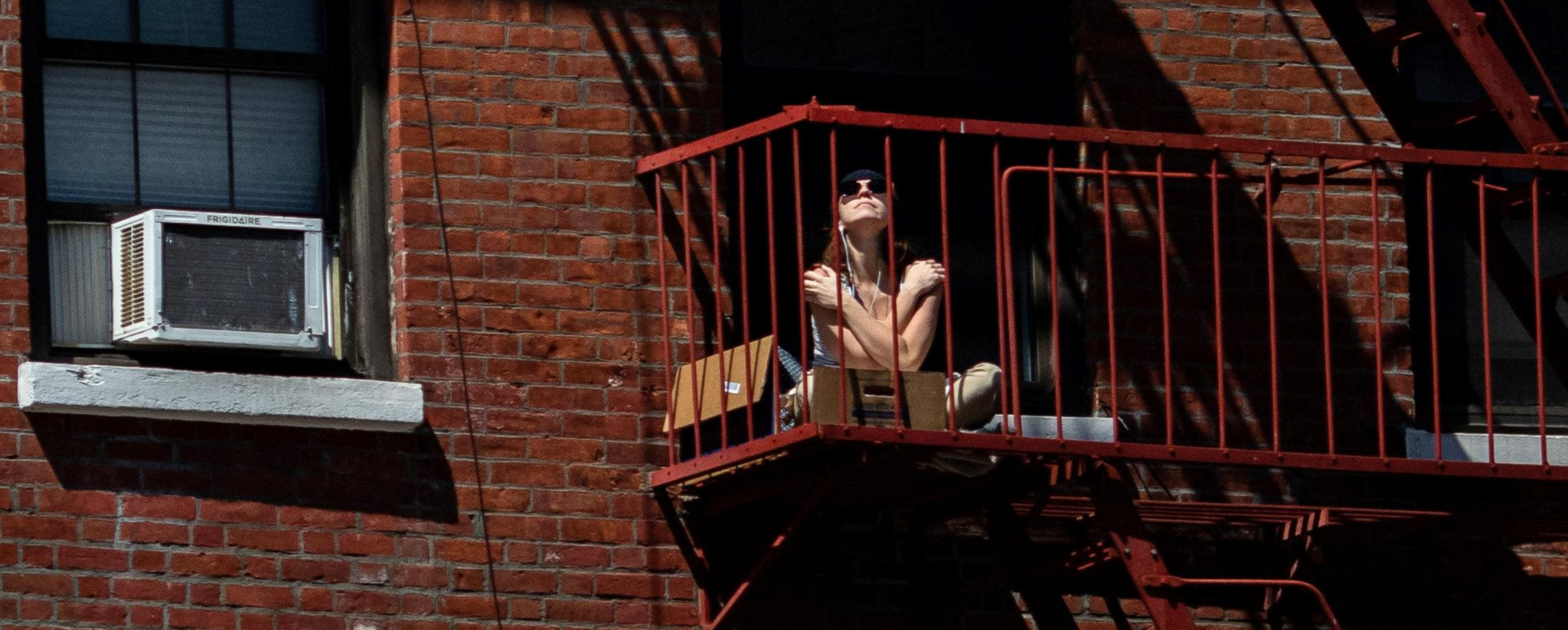 Girl Sunbathing on her balcony